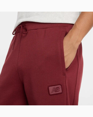 New Balance pantaloni Post Season Pique Track Pant